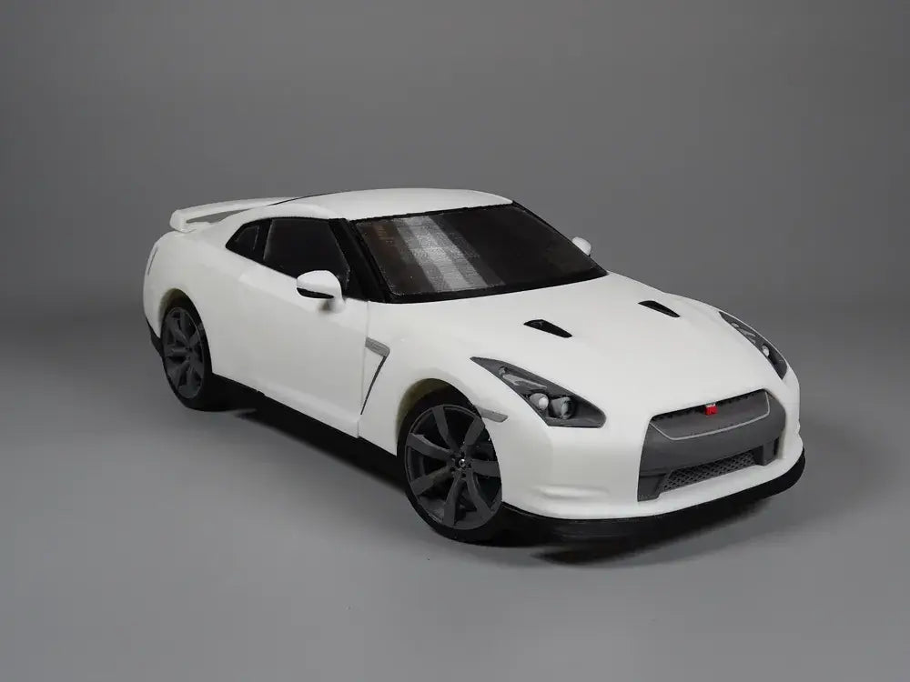 Nissan GT-R R35 Performance Edition Modellauto in weiß mit sportlichem Design und hochwertigen Details.